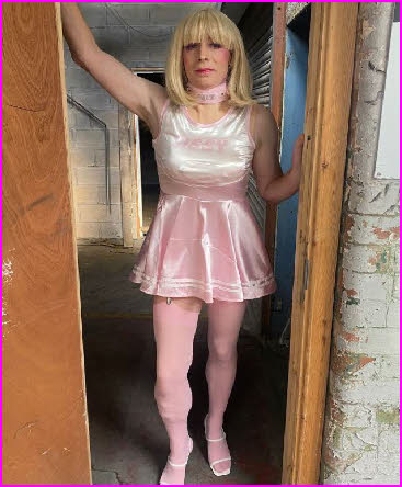 Grown man fully emasculated in truly tragic pink frock and stockings Grown man fully emasculated in truly tragic pink frock and stockings