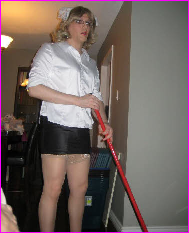 Exposed sissy maid Janey sweeping the floor