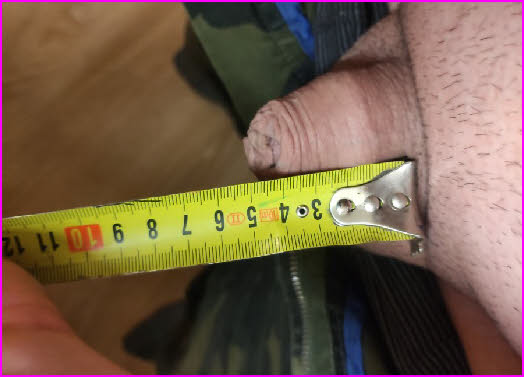 The tape measure proving just how small and useless Sissy Olga's clitoris is