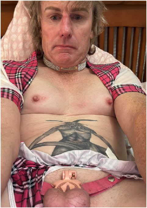 Cross-dressing sissy Murray Chapman exposed in painful chastity cage