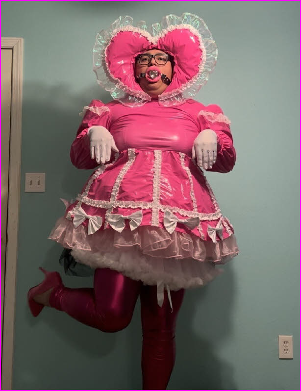 Limp-wristed sissy Pink Shiny Bitch wearing a shiny pink frock with petticoats Limp-wristed sissy Pink Shiny Bitch wearing a shiny pink frock with petticoats