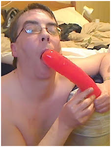 Oldham cum-slut Peter Fitton licking his huge red dildo