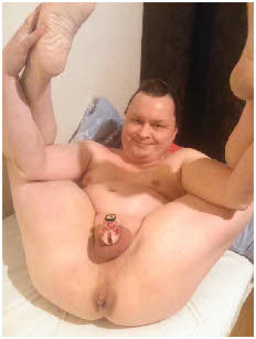 Gay sissy slut Piotr spreads his thighs to expose his caged dick