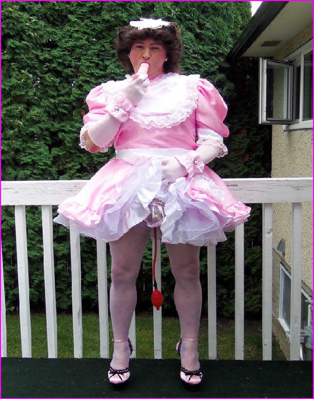 Cock-hungry sissy maid Teri from Canada sucks a dildo in his pretty pink uniform