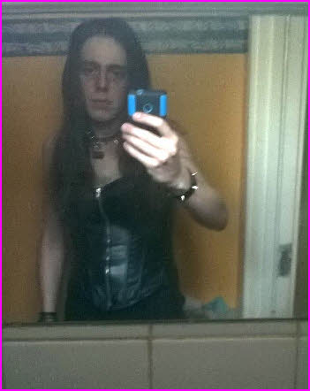 Cross-dressing sissy in black leather corset Cross-dressing sissy in black leather corset