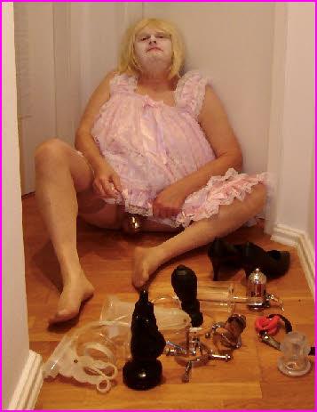Dumb sissy Lotti locked in chastity and surrounded by huge anal toys Dumb sissy Lotti locked in chastity and surrounded by huge anal toys