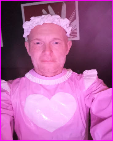 Dumb sissy Nico dressed in a ridiculous pink latex maid uniform