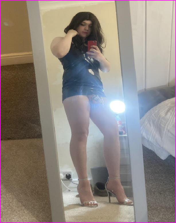 Sissy femboi Olivia with his caged cock exposed