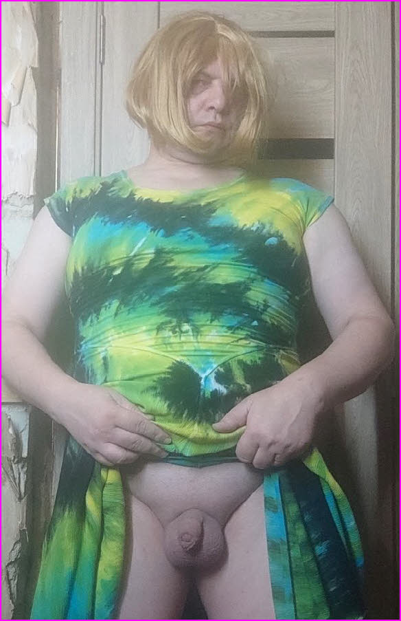 Sissy Olga hitches up his dress to expose his hilariously tiny dick